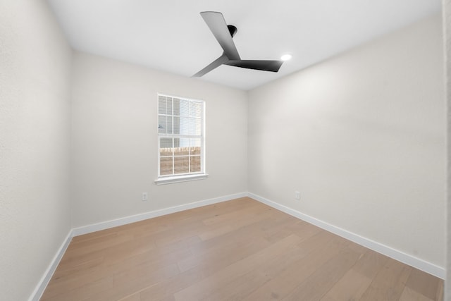 unfurnished room featuring ceiling fan and light hardwood / wood-style floors