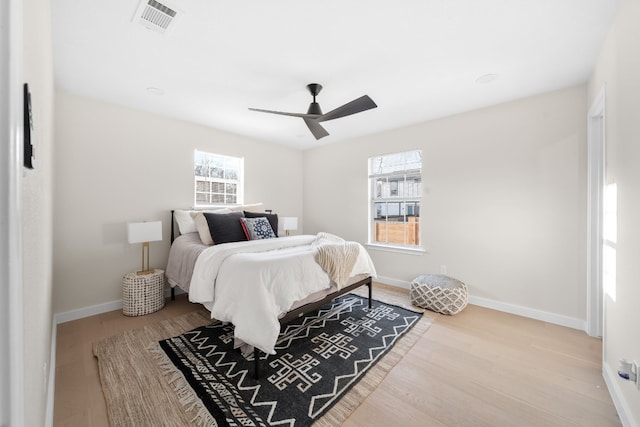 bedroom featuring wood-type flooring and ceiling fan