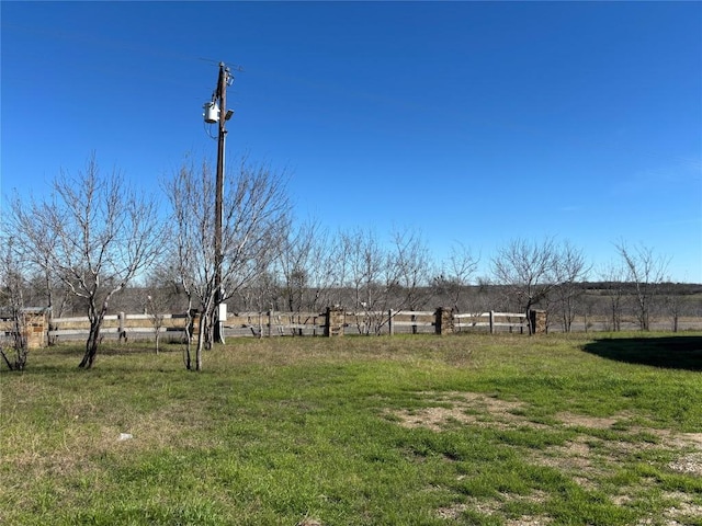 view of yard with a rural view