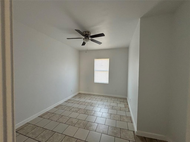 spare room featuring light tile patterned flooring and ceiling fan