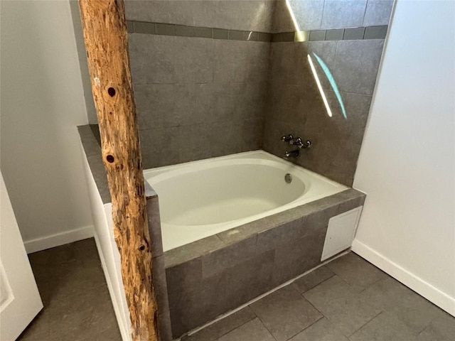 bathroom with tiled shower / bath and tile patterned floors