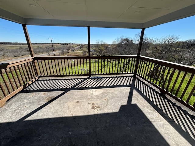 wooden deck featuring a yard