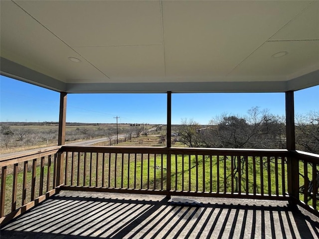 wooden deck featuring a yard