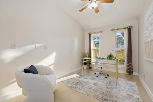 home office featuring lofted ceiling and ceiling fan