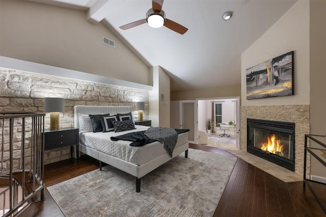 bedroom featuring ceiling fan, high vaulted ceiling, beam ceiling, and hardwood / wood-style floors