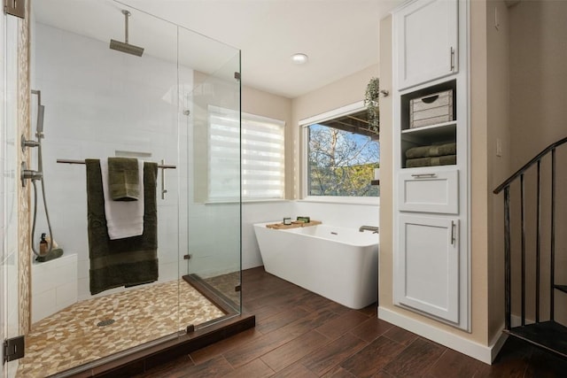 bathroom featuring separate shower and tub