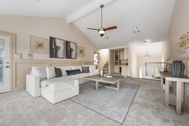 living room featuring light carpet, ceiling fan, high vaulted ceiling, and beamed ceiling