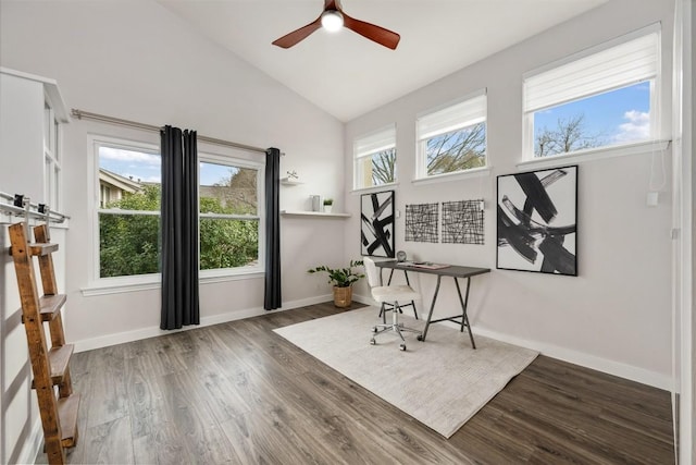 office area featuring dark wood-type flooring, ceiling fan, and high vaulted ceiling