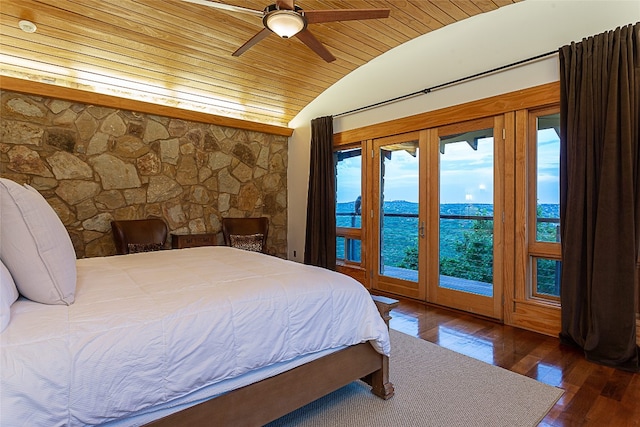 bedroom featuring ceiling fan, vaulted ceiling, dark hardwood / wood-style flooring, access to outside, and wooden ceiling