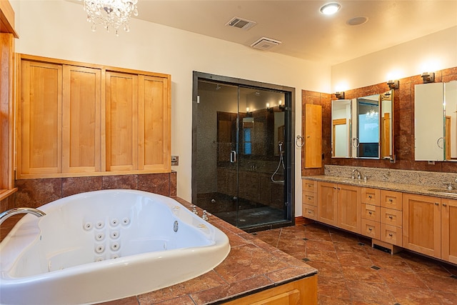 bathroom featuring vanity and separate shower and tub