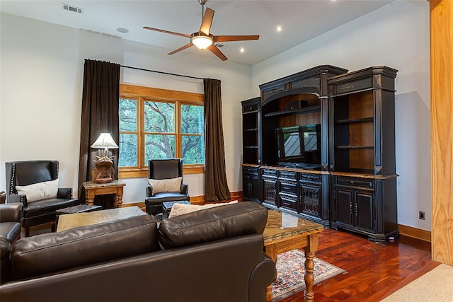 living room with ceiling fan and dark hardwood / wood-style flooring