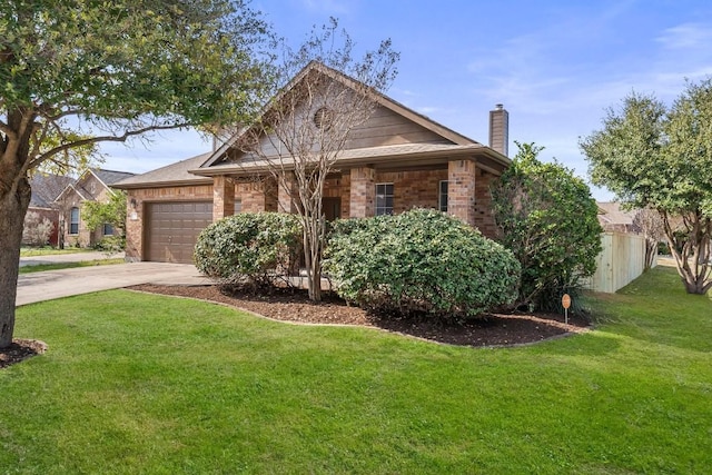 view of front of property featuring a garage and a front yard