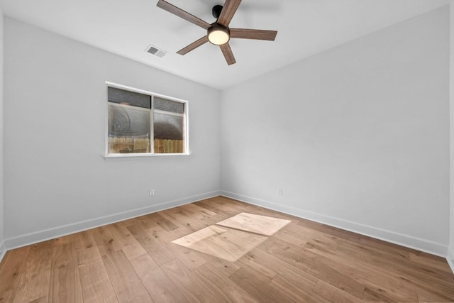 spare room featuring ceiling fan and light wood-type flooring