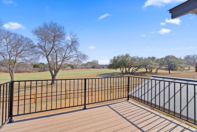 wooden terrace with a lawn