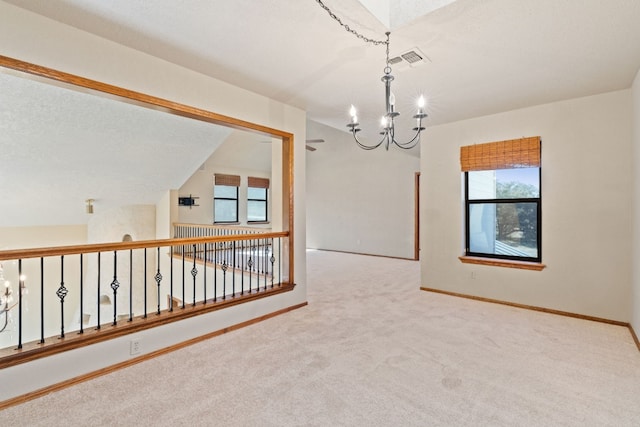 1210 Sun Ray, Horseshoe Bay, TX 78657 - carpeted empty room featuring a chandelier and plenty of natural light