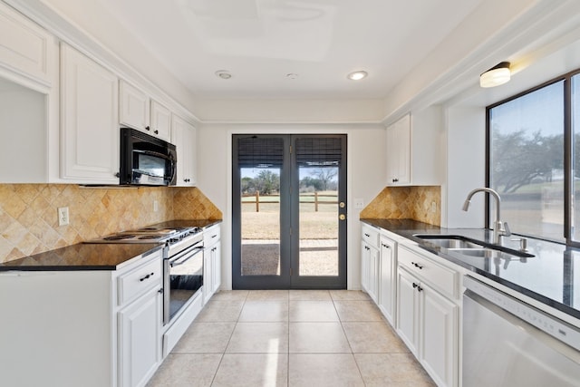 kitchen with sink, electric range, white dishwasher, a healthy amount of sunlight, and white cabinets