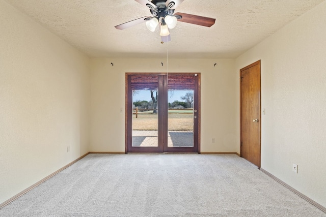 1210 Sun Ray, Horseshoe Bay, TX 78657 - unfurnished room with carpet floors, a textured ceiling, and a ceiling fan