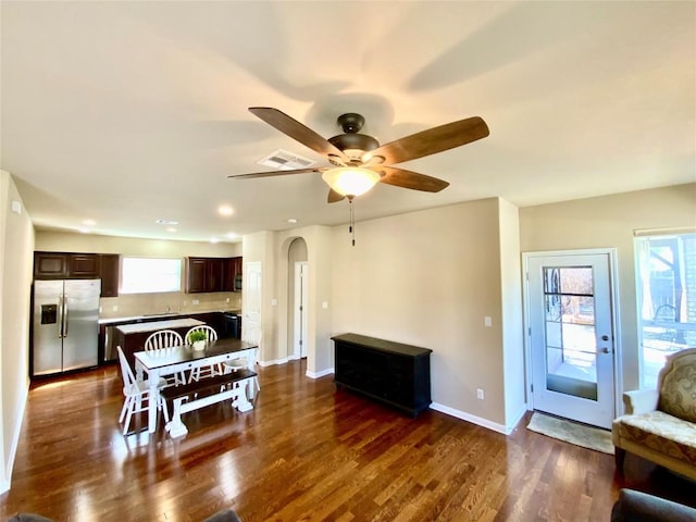 dining room with dark hardwood / wood-style flooring and ceiling fan