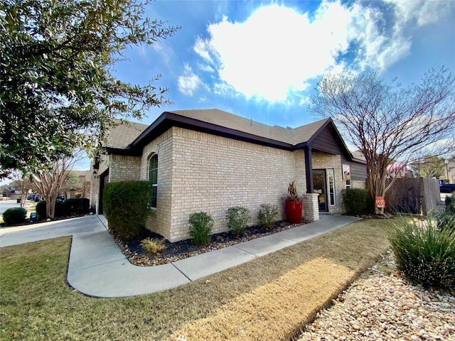 view of property exterior featuring a yard