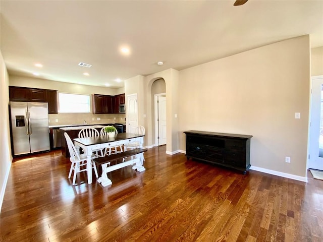 dining area featuring dark wood-type flooring