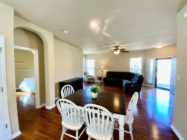 dining room featuring dark wood-type flooring and ceiling fan