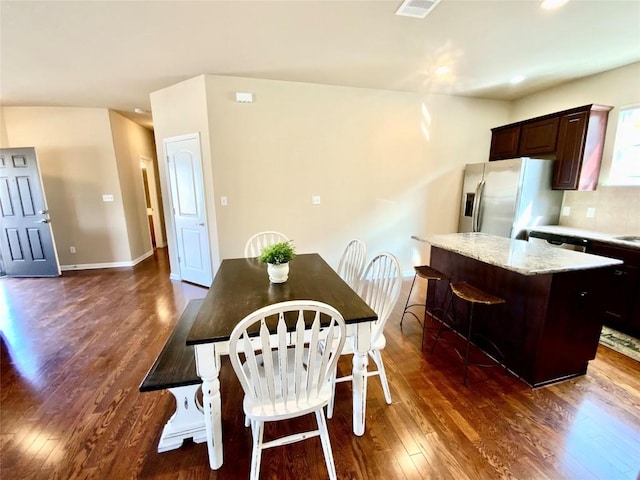 dining room featuring dark wood-type flooring