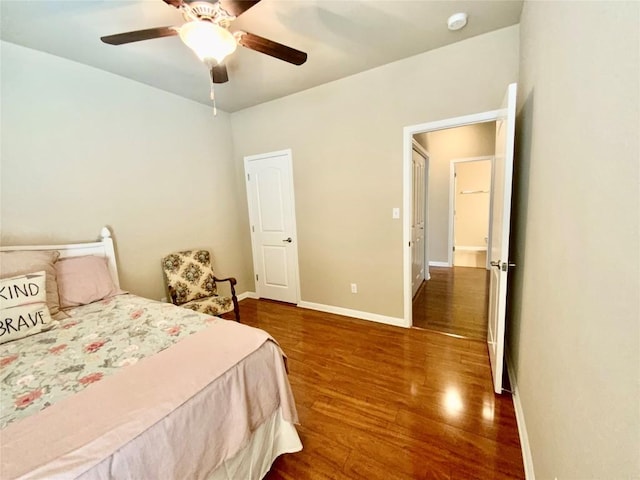 bedroom with hardwood / wood-style flooring and ceiling fan