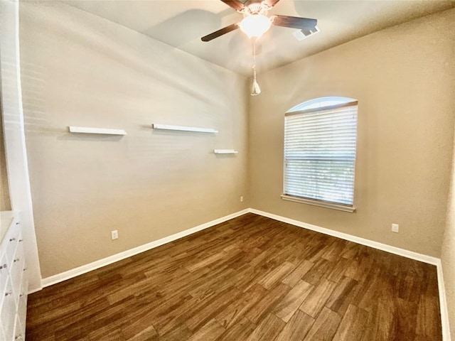 empty room featuring hardwood / wood-style flooring and ceiling fan