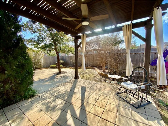 view of patio featuring ceiling fan