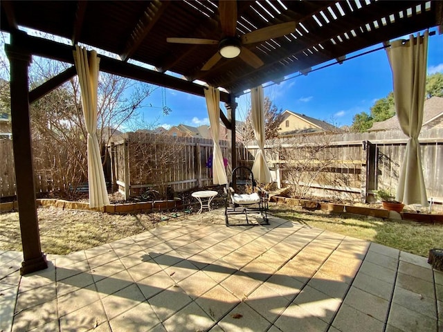 view of patio featuring ceiling fan and a pergola