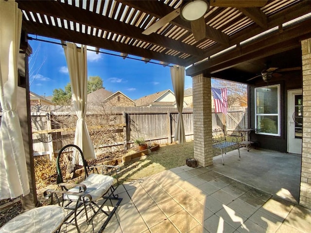 view of patio featuring ceiling fan and a pergola