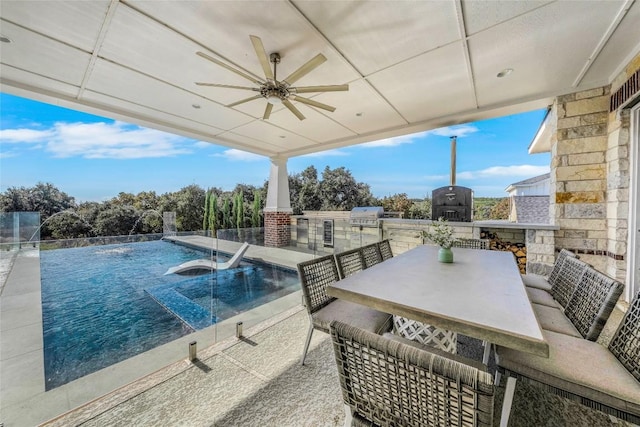 view of pool with a grill, area for grilling, ceiling fan, and a patio area