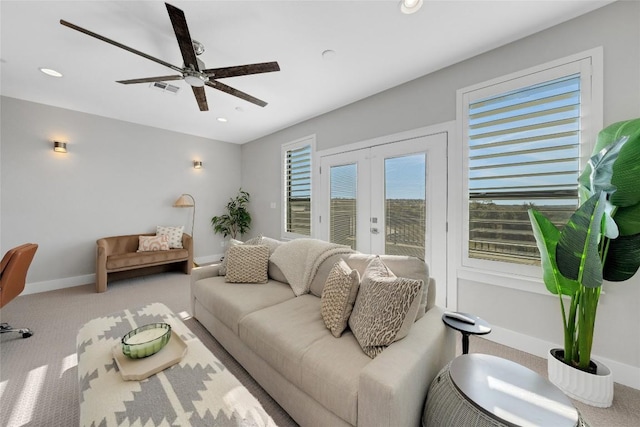 living room with light carpet, ceiling fan, and french doors