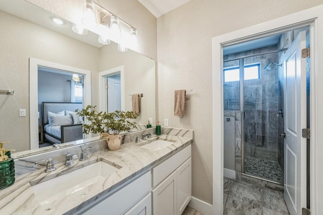 bathroom featuring vanity and a shower with door