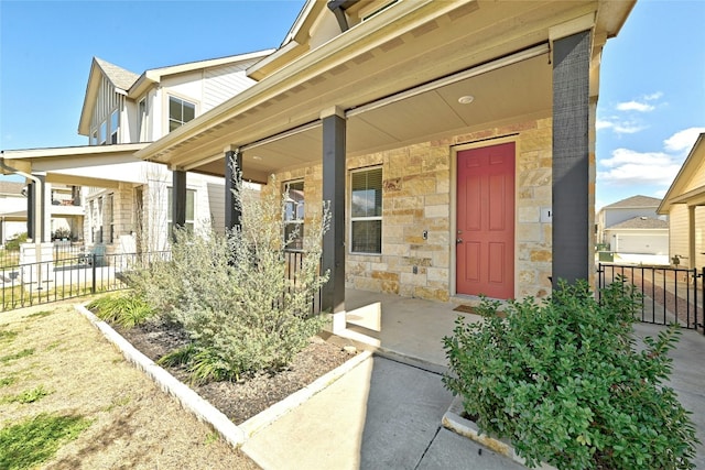 property entrance featuring covered porch