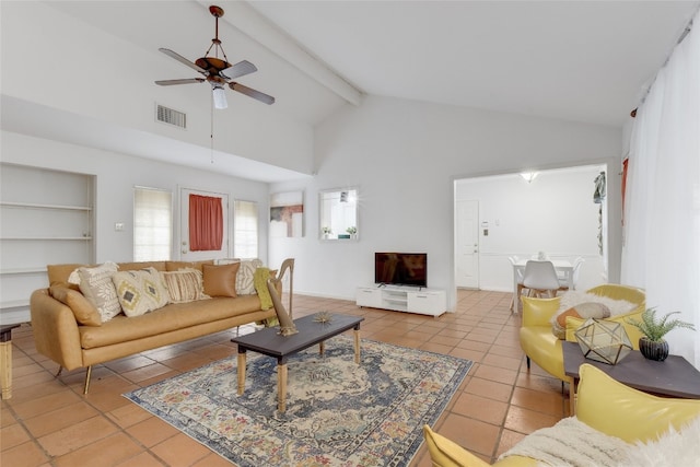 tiled living room featuring beam ceiling, high vaulted ceiling, and ceiling fan