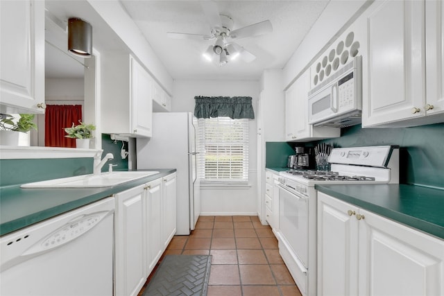 kitchen featuring tile patterned flooring, ceiling fan, white cabinets, and white appliances