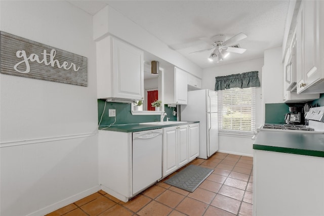 kitchen with white cabinetry, sink, ceiling fan, and white appliances