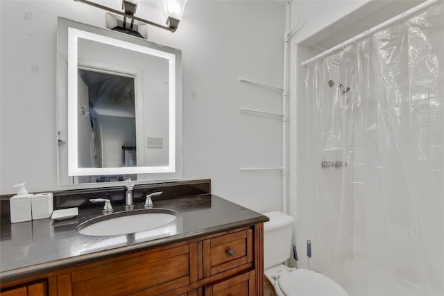 bathroom with walk in shower, vanity, and toilet