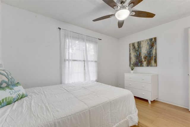 bedroom featuring ceiling fan and light wood-type flooring