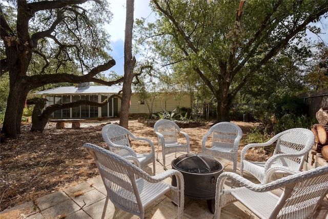 view of patio / terrace featuring an outdoor fire pit