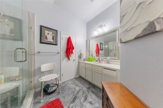 bathroom featuring vanity and an enclosed shower