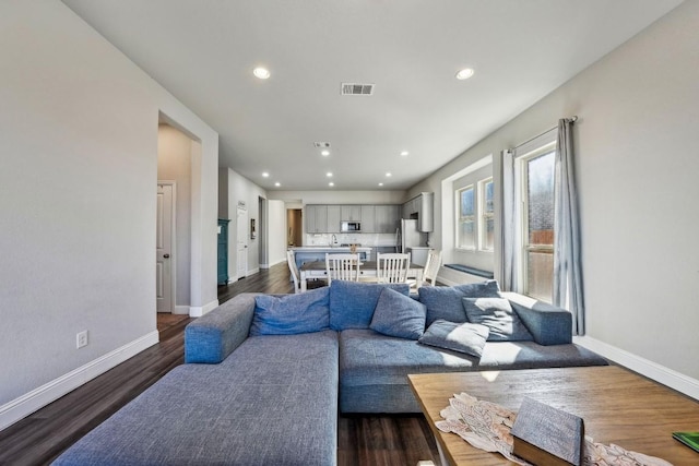 living room featuring dark hardwood / wood-style flooring