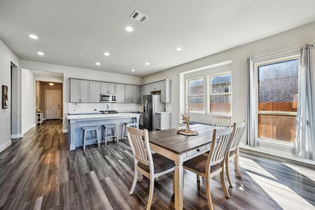 dining space featuring dark hardwood / wood-style floors