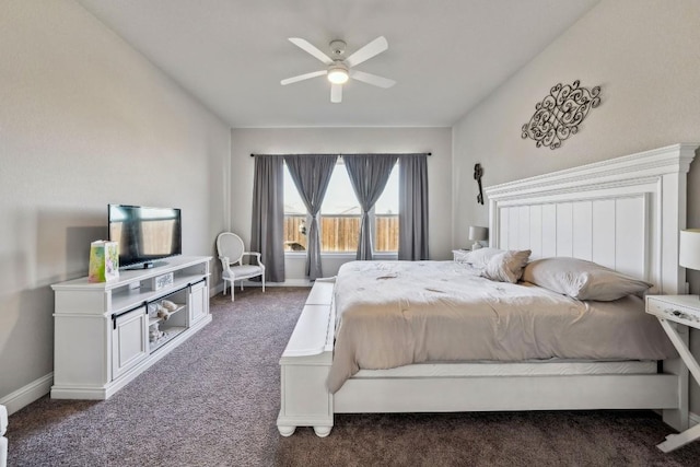 bedroom with ceiling fan and dark colored carpet