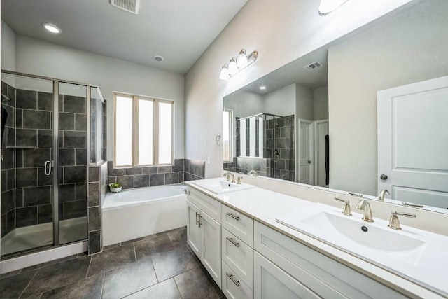 bathroom with vanity and separate shower and tub