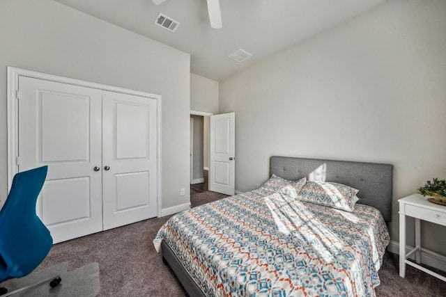 bedroom with ceiling fan, dark carpet, and a closet