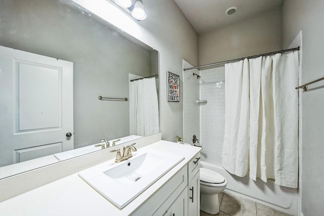 full bathroom featuring vanity, shower / tub combo with curtain, tile patterned floors, and toilet