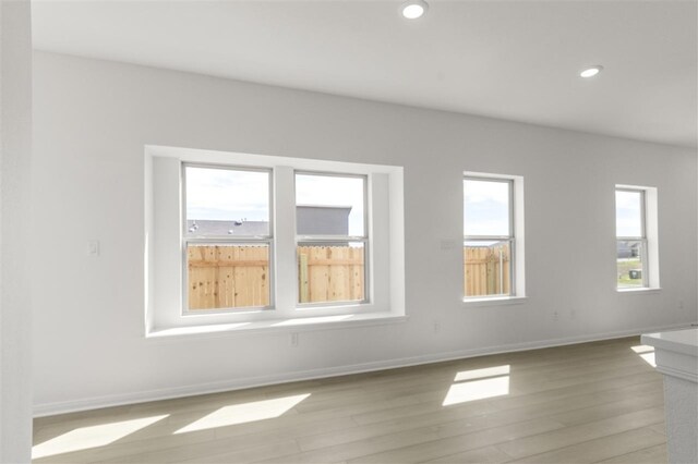 332 Witchhazel Way, San Marcos, TX 78666 - empty room featuring light wood-style flooring, baseboards, and recessed lighting