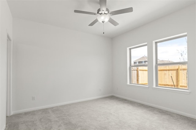332 Witchhazel Way, San Marcos, TX 78666 - spare room featuring light colored carpet, baseboards, and a ceiling fan